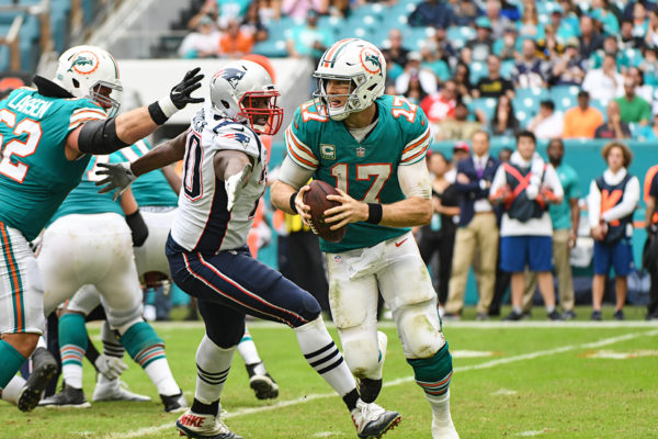 Miami Dolphins quarterback Ryan Tannehill (17) scrambles