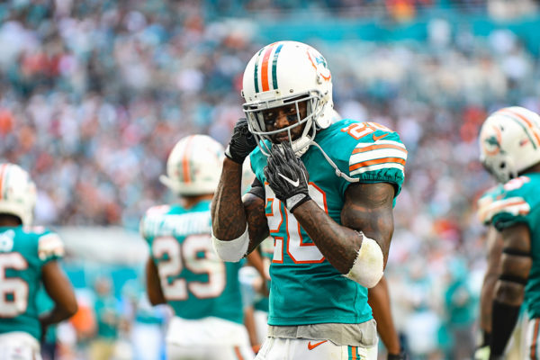 Miami Dolphins free safety Reshad Jones (20) adjusts his helmet