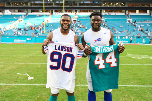 Buffalo Bills defensive end Shaq Lawson (90) and Miami Dolphins linebacker Stephone Anthony (44)