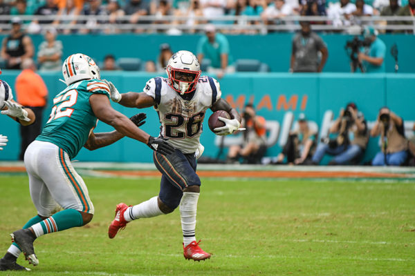 New England Patriots running back Sony Michel (26) with a stiff arm