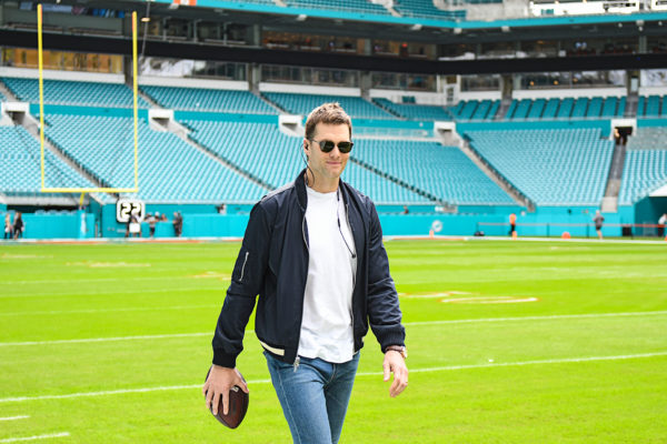 New England Patriots quarterback Tom Brady (12) is all smiles before the game