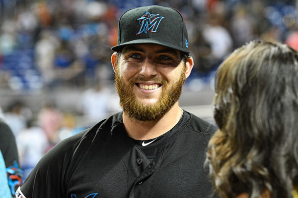 Miami Marlins left fielder Austin Dean (44) is all smiles after his 4 hit performance