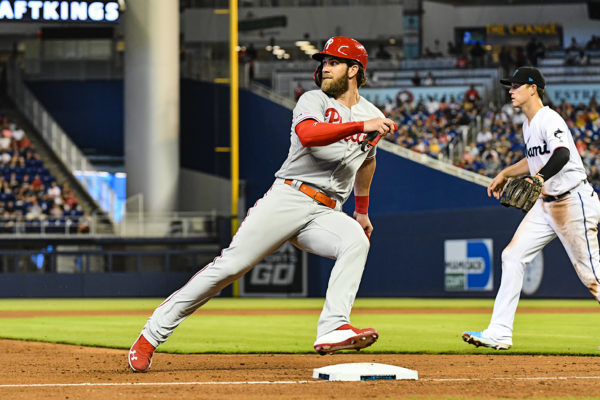 Philadelphia Phillies right fielder Bryce Harper (3) looks at the outfielder while rounding third base