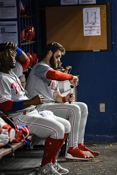 Philadelphia Phillies right fielder Bryce Harper (3) tapes his bat