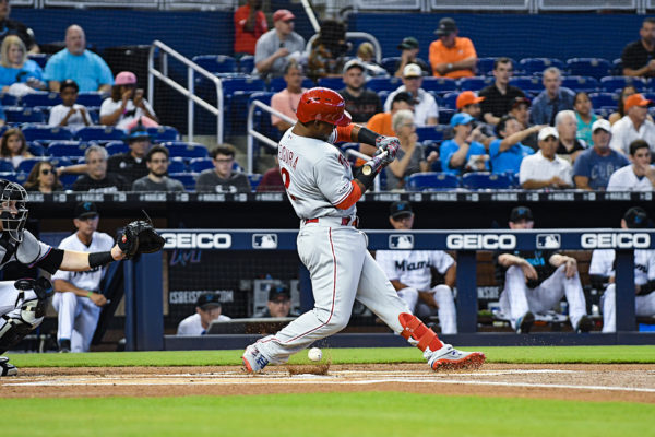 Philadelphia Phillies shortstop Jean Segura (2) check his swing as the ball hits the dirt