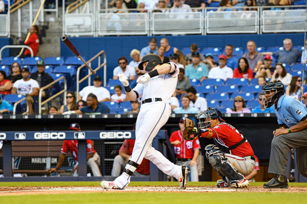 Miami Marlins catcher Chad Wallach #17 loses the grip on his bat