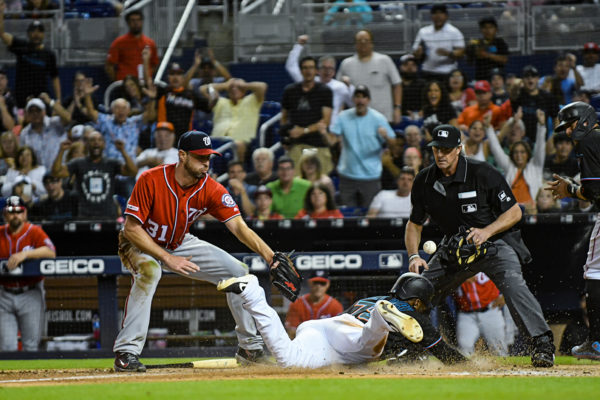 Miami Marlins right fielder Isaac Galloway #79 slides safely into home
