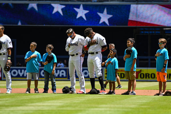 Miami Marlins shortstop Miguel Rojas #19 and Miami Marlins second baseman Starlin Castro #13