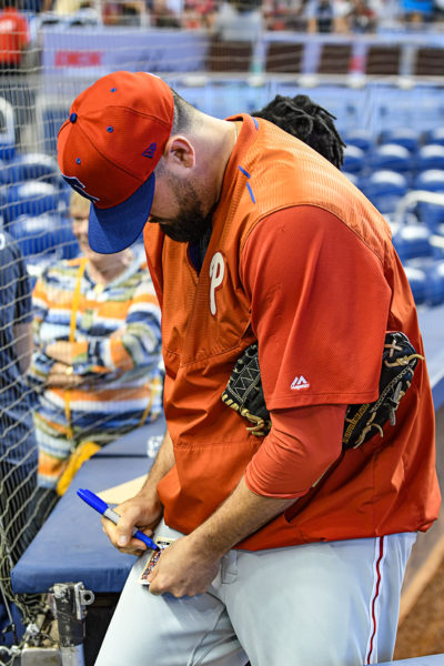 Philadelphia Phillies relief pitcher Pat Neshek (93) signs an autograph