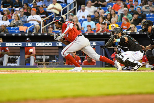 Washington Nationals center fielder Victor Robles #16 lays down a bunt