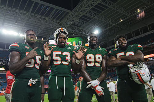 Hurricanes players pose after the game