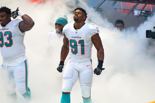 Miami Dolphins defensive line comes out through the smoke together