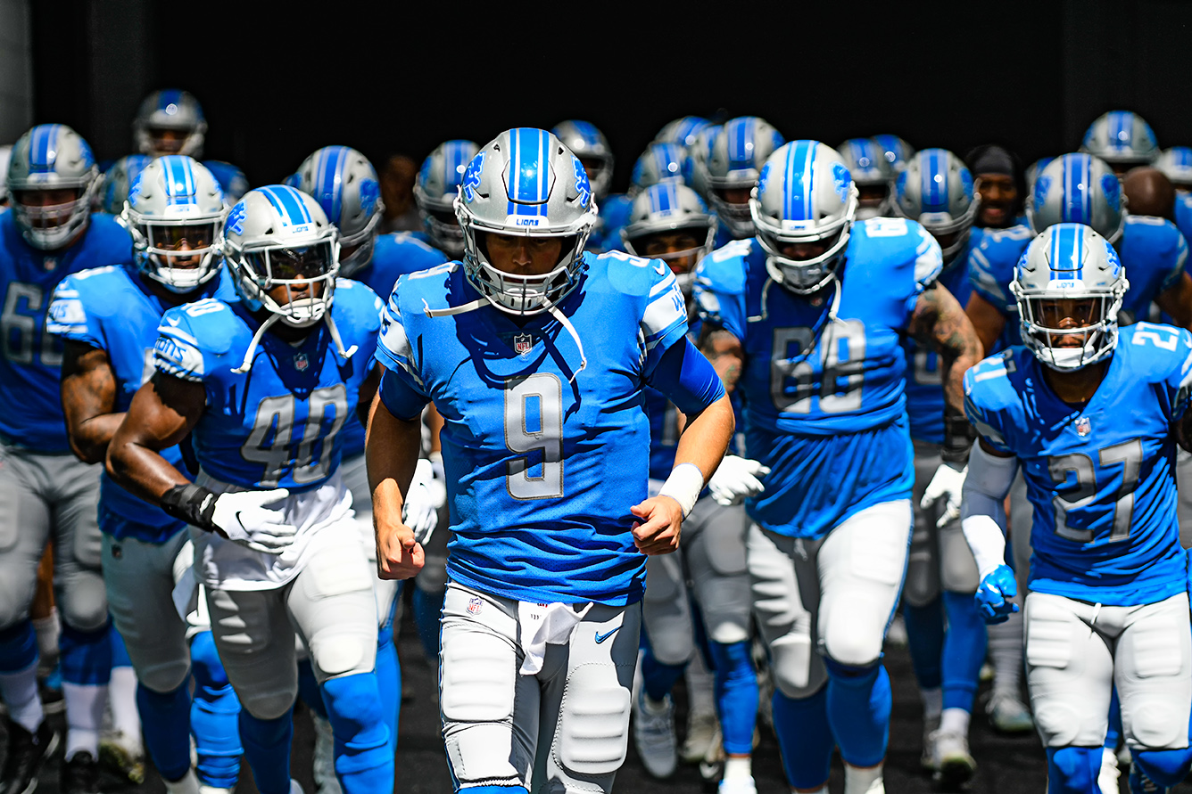 Detroit Lions quarterback Matthew Stafford (9) leads the team out to the field
