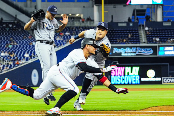 Tampa Bay Rays first baseman Ji-Man Choi (26) tags Miami Marlins shortstop Miguel Rojas (19)