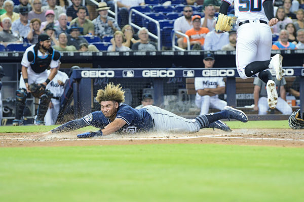 San Diego Padres Josh Naylor #22 slides across home - San Diego Padres vs. Miami Marlins at Marlins Park