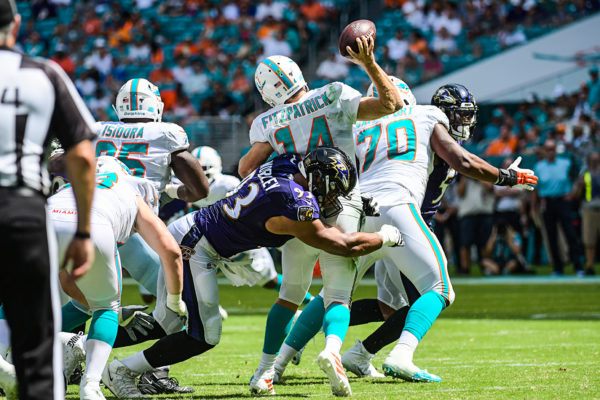 Baltimore Ravens nose tackle Chris Wormley (93) hits Miami Dolphins quarterback Ryan Fitzpatrick (14) as he throws | Baltimore Ravens vs. Miami Dolphins | September 8, 2019 | Hard Rock Stadium